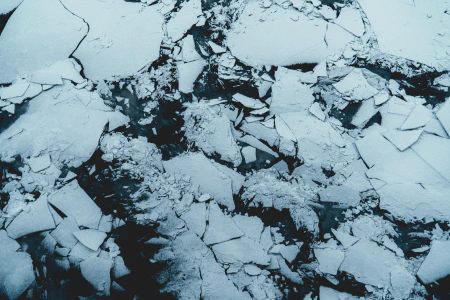 A photo of an ice floe with big chunks shattered and overlapping.